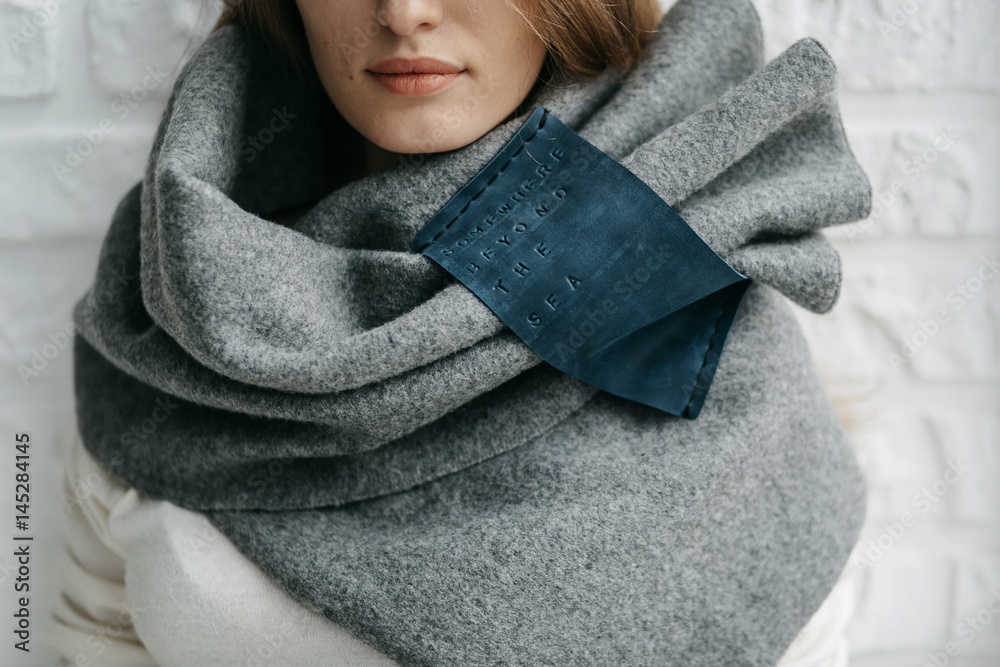 Winter warm scarf around the neck of the girl