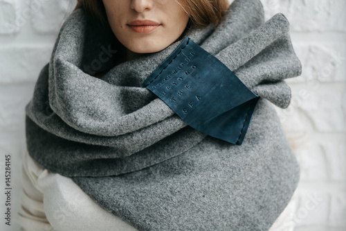 Winter warm scarf around the neck of the girl