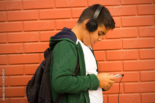Boy Is Listening Music With Smartphone 