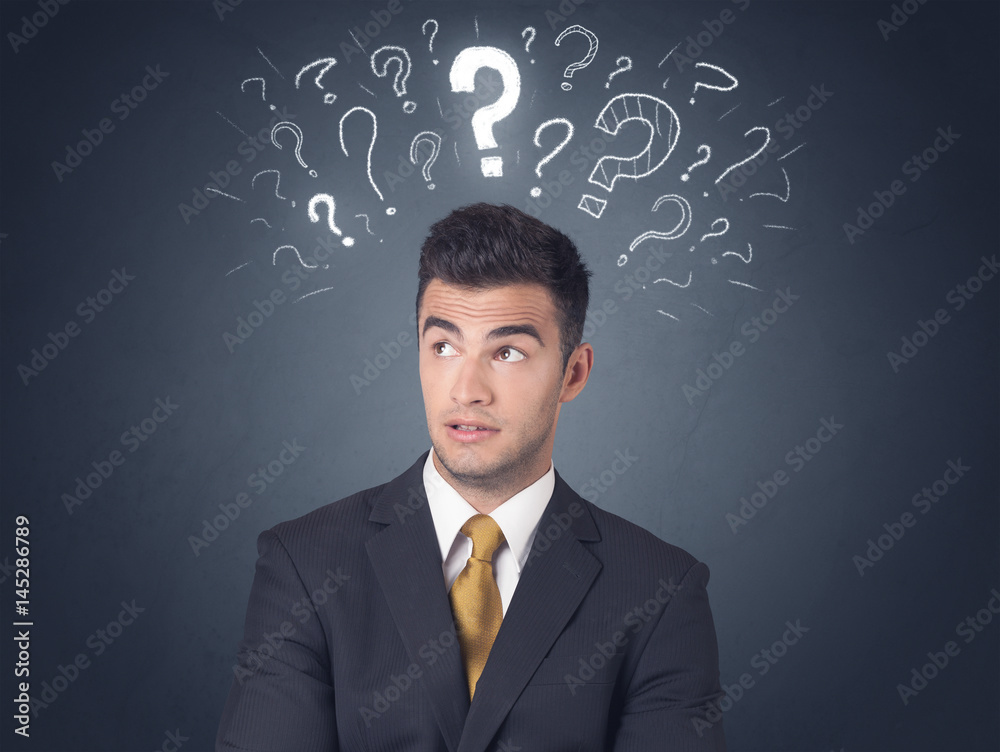 Businessman with question marks Businessman with question marks