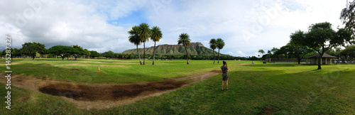 Beautiful panorama of the Diamond Head on the Hawaiian island of Oʻahu. The volcanic tuff cone is also called Lēʻahi. The photo was taken at the Kapiolani Regional Park in Honolulu