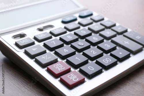 Calculator on table, closeup