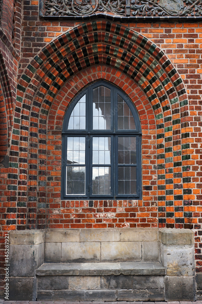 Window in brick wall of Old Town Hall in Hannover, Germany.