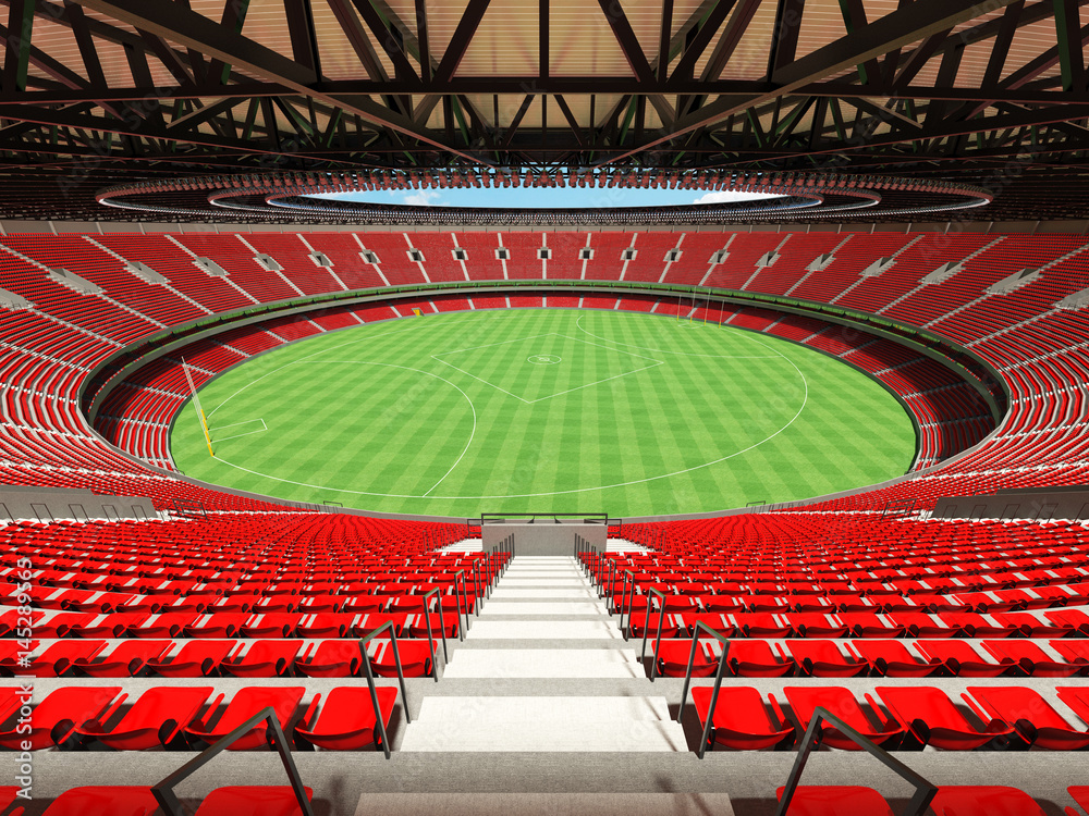 3D render of a round Australian rules football stadium with  red seats and VIP boxes