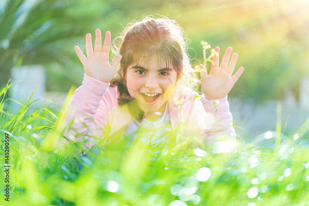 Pretty child playing outdoors Pretty child playing outdoors
