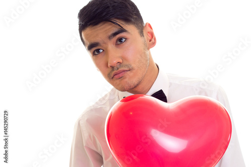 Young man with bow-tie holding balloon © Dmitry Bairachnyi