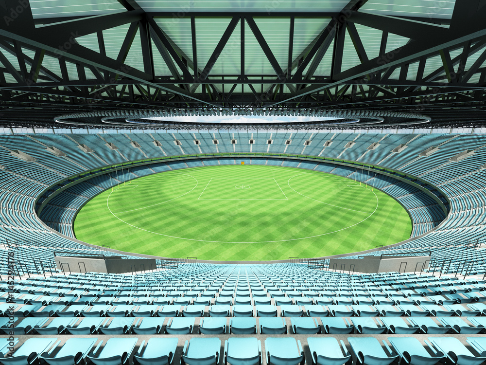 Fototapeta premium 3D render of a round Australian rules football stadium with sky blue seats and VIP boxes