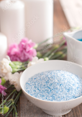 Beautiful spa composition with spring flowers and sea salt.