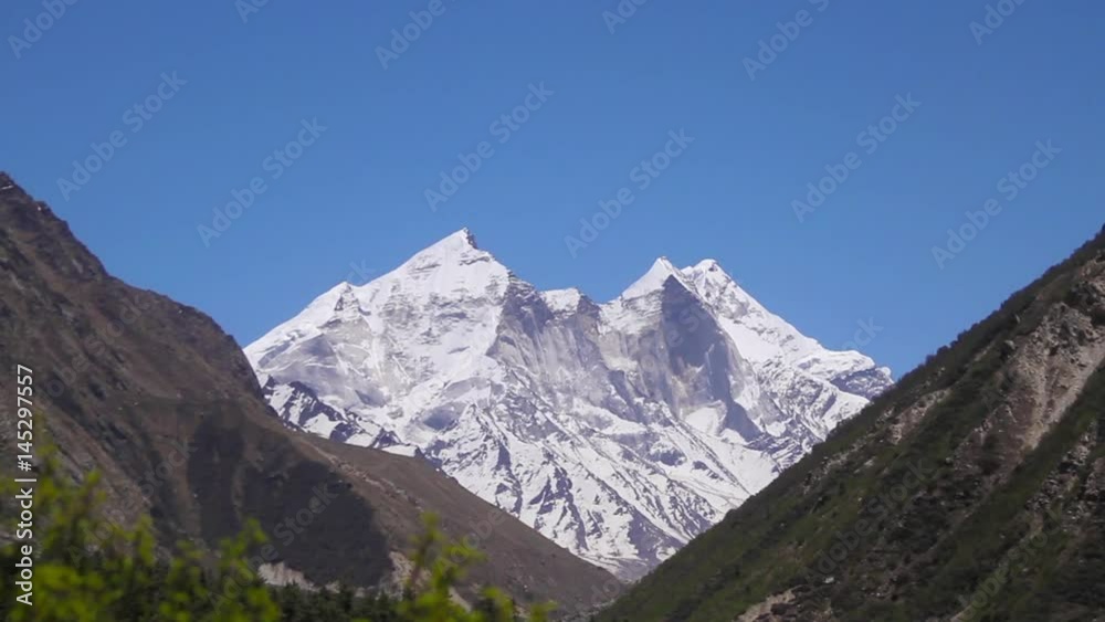 Himalayan peak at the end of a green valley. Himalayan peak at the end of a green valley.