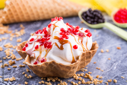 Ice cream with caramel jam, is served with jelly balls photo