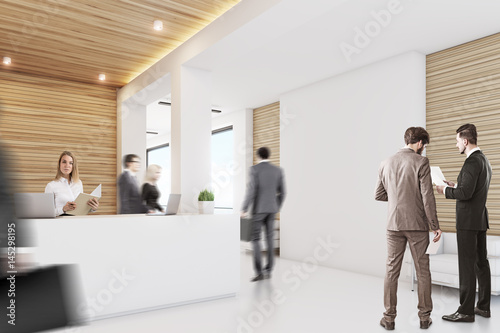 Light wood reception, armchair, side, people