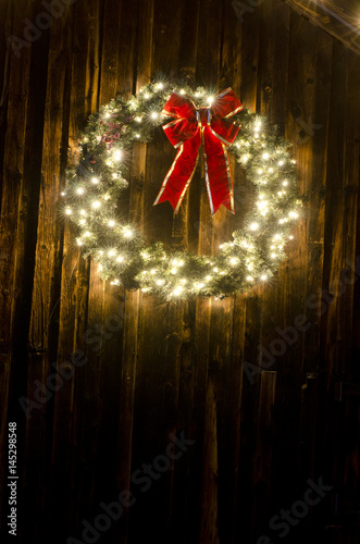 Lighted Christmas Wreath on Old Barn