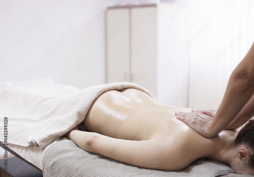 Obraz premium Anti cellulite massage for young woman in beauty salon