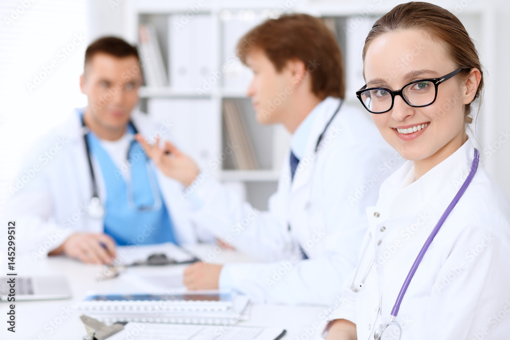Happy doctor woman with medical staff at the hospital. Happy doctor woman with medical staff at the hospital.