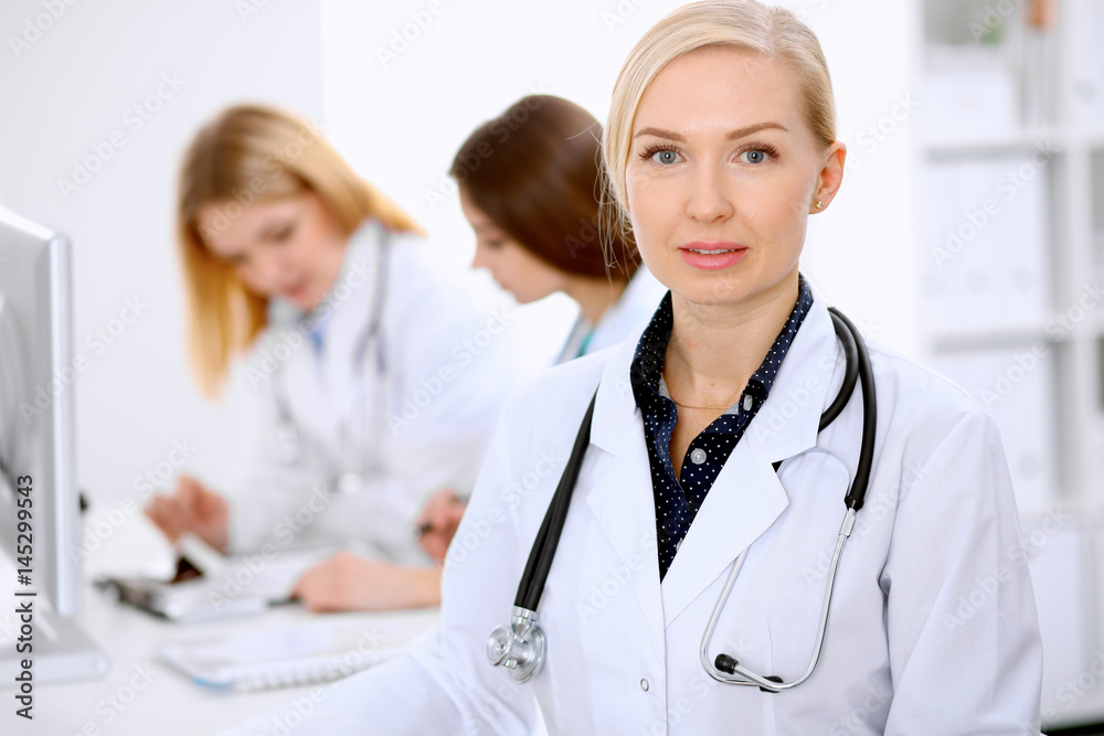 Female doctor leading a medical team at the hospital Female doctor leading a medical team at the hospital