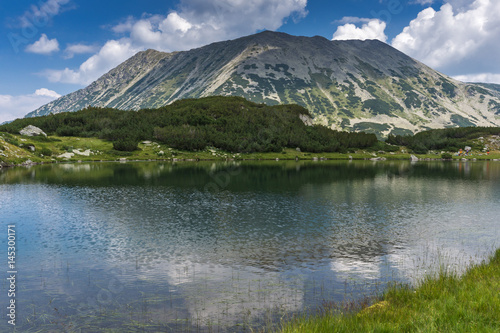Panorama with Todorka Peak and reflection in Muratovo lake  Pirin Mountain  Bulgaria