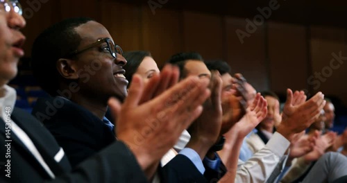 African American man business executives applauding in a business meeting photo