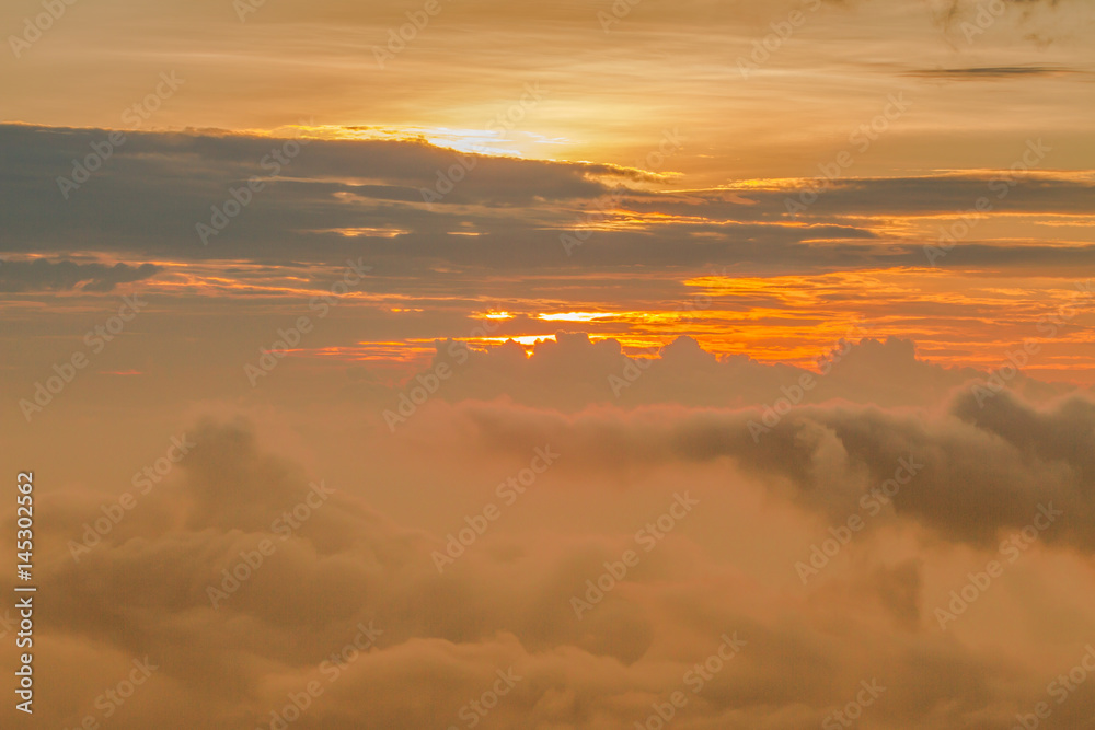 Fototapeta premium Shot from an airplane. Evening sunset. Background of clouds, sun