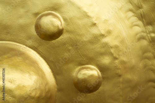 Painted canvas golden color painted texture on metal photo