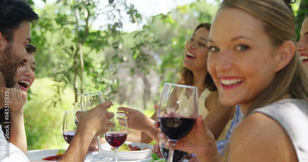 Group of friends toasting red wine glasses Group of friends toasting red wine glasses