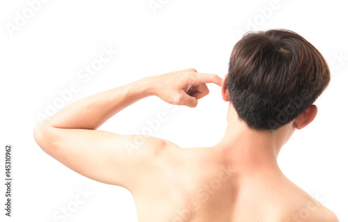 Man scratching an itch ear with finger on white background, health care and medical concept