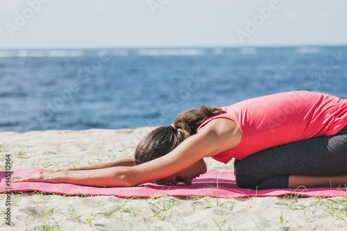 sporty woman doing stretching yoga exercise