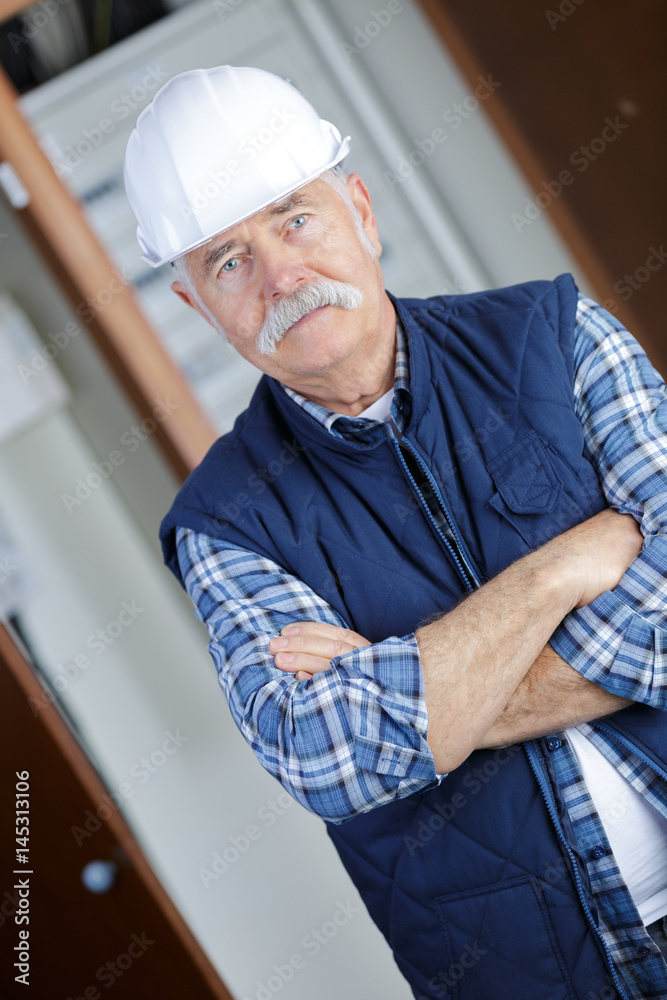portrait of confident worker with arms crossed portrait of confident worker with arms crossed
