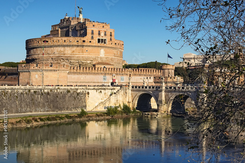 Castle of Holy Angel (Castel Sant Angelo) and Holy Angel Bridge over the Tiber River in Rome at sunny winter day. Rome. Italy