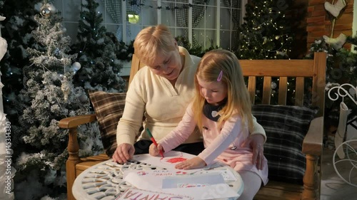Childhood Memories Grandma and Little Girl Drawing Together at Home New Year Celebration Lights Are Sparkilng in Cosy Room Family Holiday Time Flies Fast