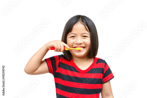 Little beautiful girl brushing teeth photo