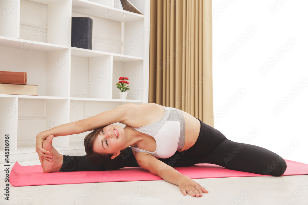 flexible sporty girl doing yoga pose