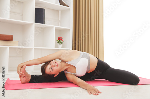flexible sporty girl doing yoga pose