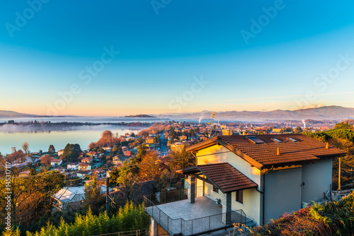 Lake Varese, Gavirate. Italy. Picturesque dawn. To the left the lake of Varese, to the right the Alps with the Monte Rosa