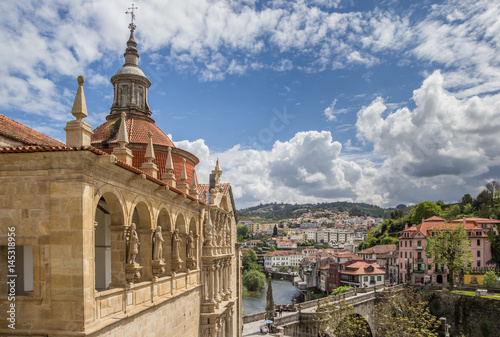 Church and roman bridge in historical town Amarante, Portugal photo