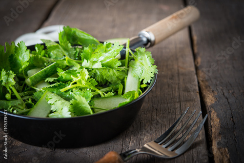 fresh cilantro salad  coriander with cucumber salad. Healthy food concept.