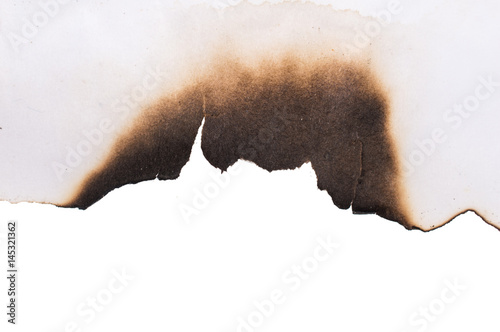 Burned sheet of paper on a white background