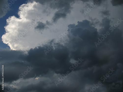 Sunlight breaking through dark thunderclouds.