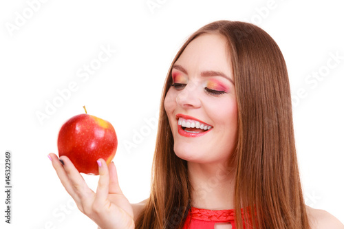 Woman charming girl colorful makeup holds apple fruit