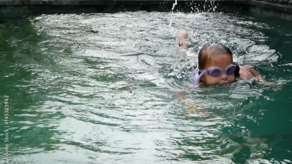 Little girl swim underwater in swimming pool. Slow Motion Stock Video ...