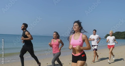 People Group Running On Beach Young Men And Women Athlete Jogging Training Outdoors Exercising On Seaside Work Out Slow Motion 60