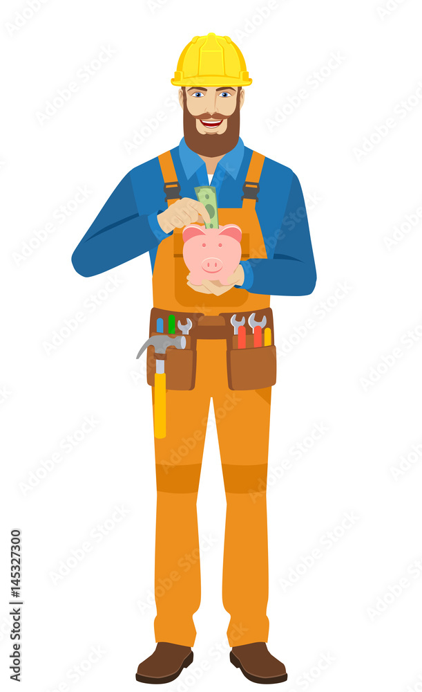Worker puts banknote in a piggy bank Worker puts banknote in a piggy bank