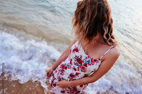 Woman standing on the beach