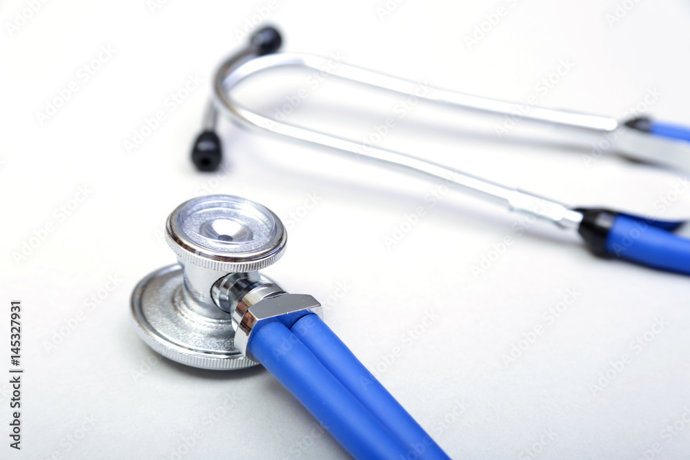 Red heart and a stethoscope on white background Red heart and a stethoscope on white background