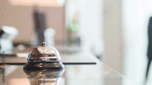 Male hand ringing service bell