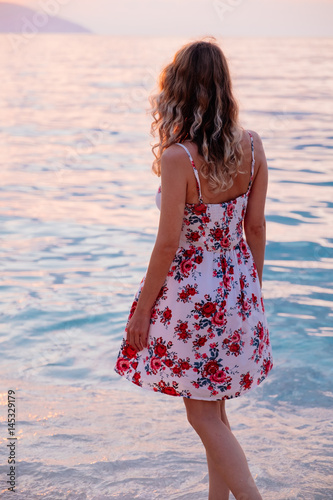 Woman standing on the beach