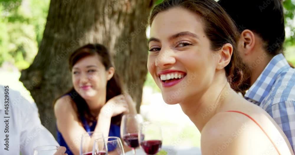 Group of friends interacting with each other while having lunch