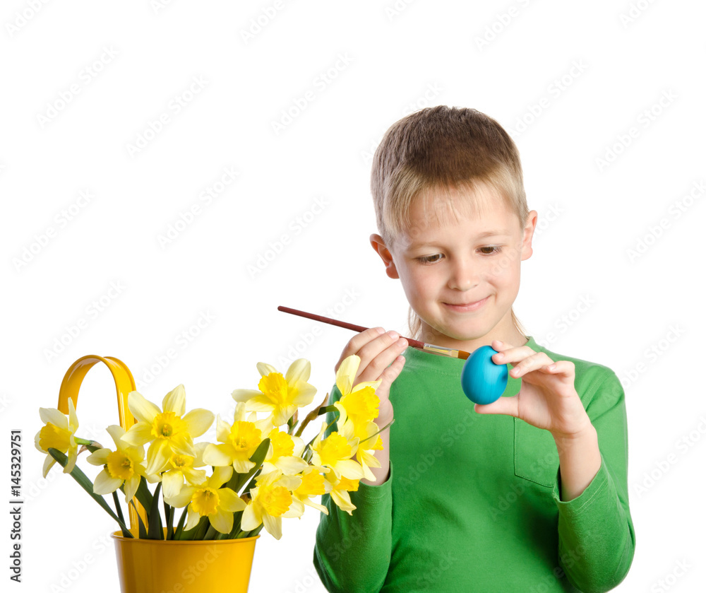 little boy painting eggs for easter isolated on white little boy painting eggs for easter isolated on white