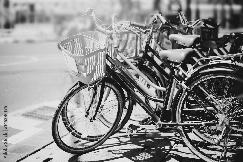 black and white travel bicycle for rent in urban. vintage color effect
