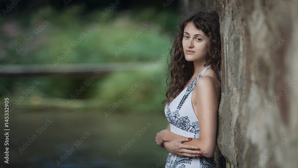 Beautiful young woman walking through the forest river. Beautiful young woman walking through the forest river.