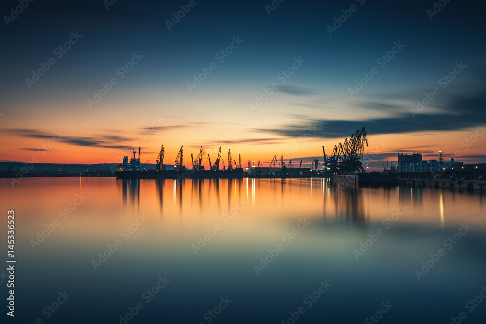 Sunset over sea port and industrial cranes, Varna